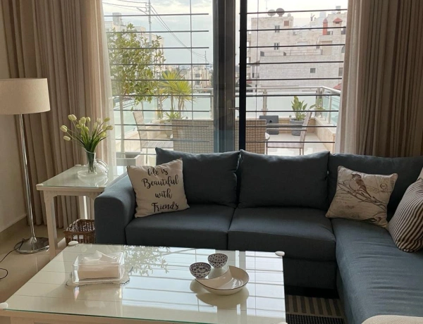Ground Floor 2-Bedroom Apartment with Terrace & Private Garage in Swefieh, Amman